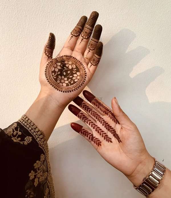 Arabic Peacock Motif mehndi design for front hand — captivating henna pattern