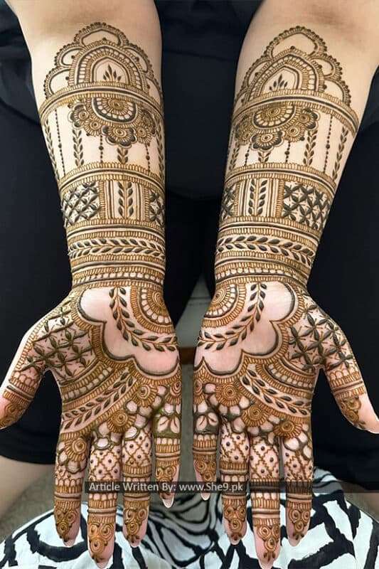 Simple Peacock Motif mehndi design for back hand — contemporary henna pattern