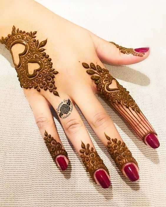 Gulf Sunburst mehndi design for back hand — intricate henna pattern