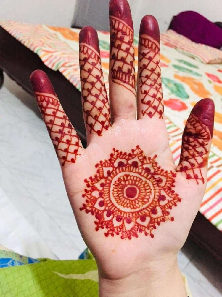 African Spiral Rosette mehndi design for back hand — dainty henna pattern