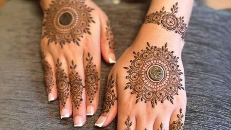 Floral Petal Arrangement mehndi design for back hand — captivating henna pattern
