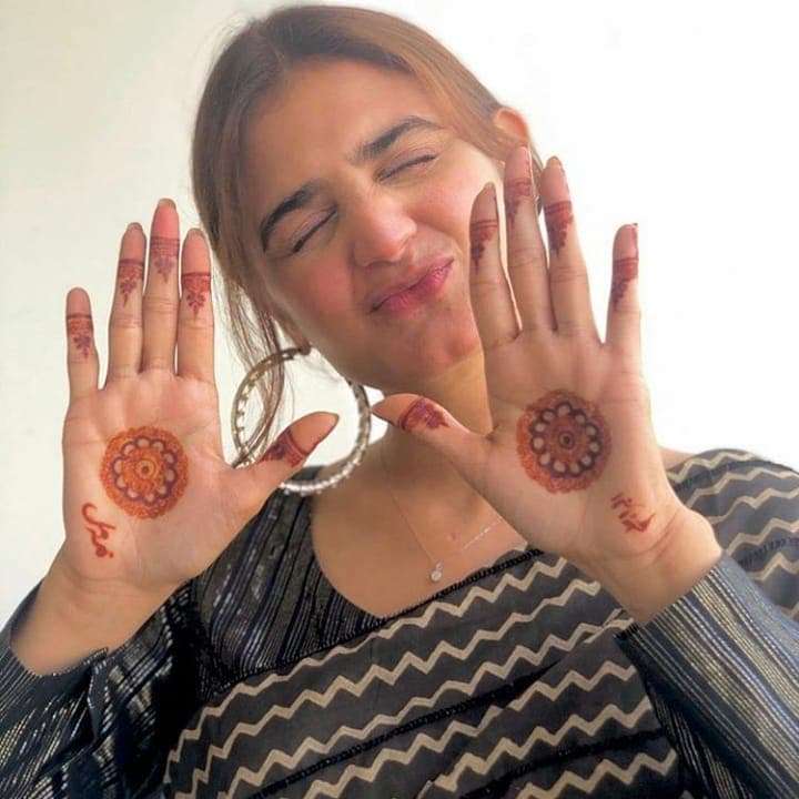 Bridal Ribbon Weave mehndi design for back hand — graceful henna pattern